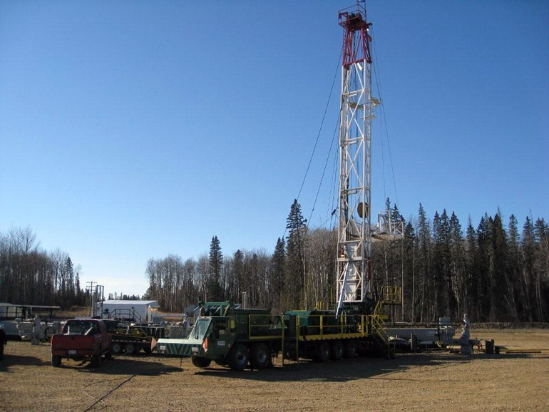 Rig 46, a well servicing rig in the field and hard at work.